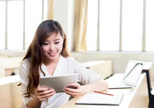 Learner reviewing study guides on a laptop